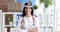 Portrait of smiling female doctor with frontal reflector on her head 4k movie slow motion