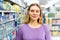 Portrait of smiling female in the modern supermarket