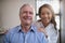 Portrait of smiling female therapist and senior male patient