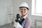 Portrait of Smiling Female Worker with Puncher