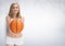 Portrait of smiling fit woman holding basketball