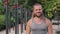 Portrait of a smiling fitness instructor with long light hair and beard