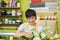 Portrait of smiling flower shop owner working. Small business.