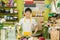 Portrait of smiling flower shop owner working. Small business.