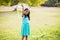 Portrait of smiling girl holding kite in park