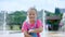 Portrait of a smiling, happy eight-year-old girl in a fun hoop with ears on her head, hair ornament. girl sends an air