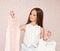 Portrait of smiling happy little girl child schoolgirl choosing dresses clothes