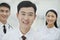 Portrait of Smiling Healthcare workers in China, Two Doctors and Nurse in Hospital, Looking At Camera