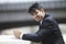 Portrait of smiling Indian businessman in pinstriped suit outdoors