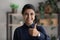 Portrait of smiling Indian woman show thumb up give recommendation