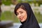 Portrait of smiling Iranian girl wearing black hijab, Isfahan, I