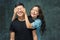 Portrait of smiling Korean couple on a gray