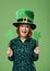 Portrait of smiling leprechaun with clover shaped banner