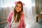 Portrait Of A Smiling Little Girl In Funny Pajamas At Home