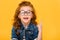 portrait of smiling little kid in eyeglasses pointing up