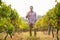 Portrait of smiling male vintner holding a glass of wine