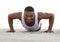 Portrait of a smiling man doing push ups