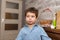 Portrait of a smiling, pretty boy of several years in the children room.