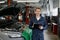 Portrait of smiling repairman mechanic at car service