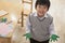 Portrait of smiling schoolboy finger painting in art class, Beijing