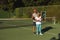 Portrait of smiling senior african american couple with tennis rackets on tennis court