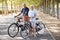 Portrait Of Smiling Senior Couple Cycling On Country Road