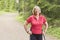 Portrait of smiling senior woman nordic walking