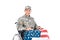 portrait of smiling soldier in wheelchair with american flag looking at camera