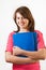 Portrait of smiling teen girl holds books isolated