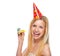 Portrait of smiling teenage girl in cap party horn blower