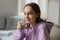 Portrait of smiling teenage girl drinking mineral water