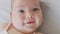 Portrait smiling to camera looking. cute little baby infant newborn toddler.