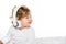 portrait of smiling toddler listening music in headphones