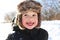 Portrait of smiling toddler walking in winter outdoors