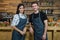 Portrait of smiling waiter and waitresses standing at counter