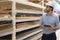 Portrait of a smiling warehouse keeper at work