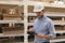 Portrait of a smiling warehouse keeper at work