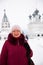 Portrait of a smiling woman on the background of the monastery in Murom