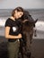 Portrait of smiling woman and brown horse. Young Caucasian woman hugging horse. Romantic concept. Love to animals. Nature concept