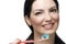 Portrait of smiling woman brushing teeth