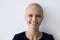 Portrait of smiling woman with cancer feel optimistic