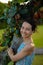 Portrait of smiling woman. Close up. Focus on the face. Tree background