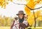 Portrait of smiling woman with dogs outdoors in autumn