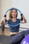 Portrait Of Smiling Woman Exercising With Pilates Ring