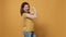 Portrait of smiling woman lifting sleeve and showing band aid after covid or flu vaccine flexing arm biceps