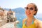 Portrait of smiling woman with sunglasses in Atrani village, Ama