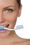 Portrait smiling woman with toothbrush in teeth
