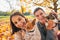 Portrait of smiling young couple with dogs outdoors