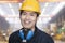 Portrait of Smiling Young Engineer in Yellow Hardhat