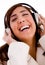 Portrait of smiling young female enjoying music